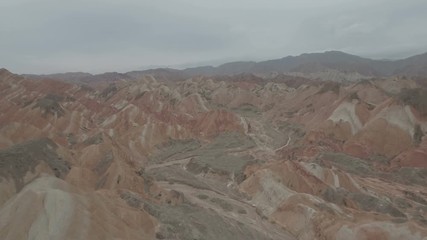 Wall Mural - retreating out of a colorful red orange mountain landscape in china