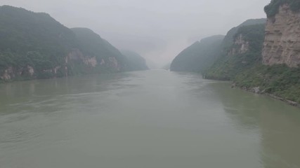 Wall Mural - misty aerial shot of three gorges yangtze river china