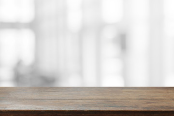 Wood table top and blurred abstract background from interior building - can used for display or montage your products.