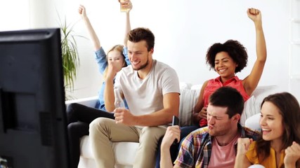 Wall Mural - friends or football fans watching soccer at home