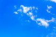 © phanthit malisuwan - Blue sky background with white clouds. The vast blue sky and clouds sky on sunny day. White fluffy clouds in the blue sky.