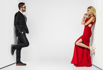 young fashion couple on a white background in studio