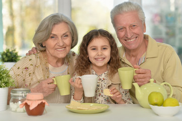 Sticker - grandparents with granddaughter drinking tea 