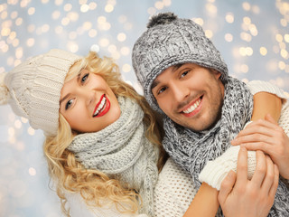 Poster - happy family couple in winter clothes hugging