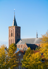 Wall Mural - Church in autumn, Naarden, Netherlands - vertical