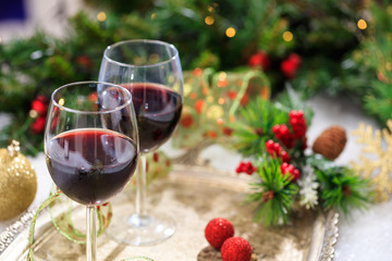 red wine glasses on snow