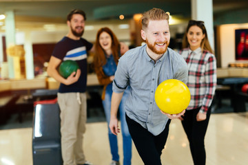 Wall Mural - Friends bowling at club