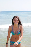 Fototapeta  - Smiling girl in a bikini 