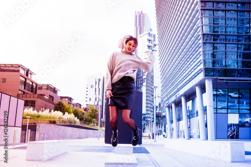 Young Beautiful Caucasian Purple Grey Hair Woman Jumping Outdoor