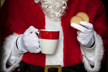 Santa Claus Having Coffee With Cookies