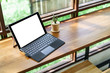 © nomadnes - Laptop with blank screen on table,Responsive design mockup,Corpo