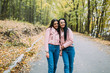 © anatoliycherkas - Two stylish, sexy and fashionable girls posing in autumn park