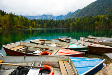 Canvas Print - Alpine landscape and colorful boats, Lake Fusine,Italy