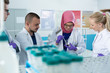 © Myvisuals - group of scientists working at the laboratory