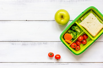 preparing lunch for child school top view on wooden background