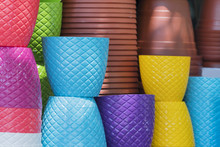 Pile Of Colored Plastic Flower Pots, Background Or Texture