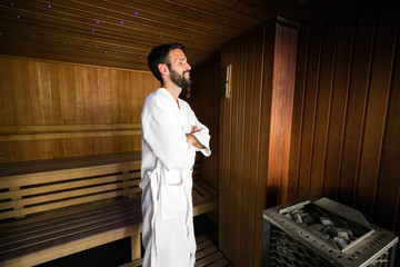 Wall Mural - Man enjoying sauna health benefits