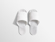 Pair of blank white home slippers, design mockup. House plain flops mock up template top view. Clear domestic sandal. Bed shoes accessory footwear.