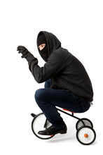 Robber On Small Children's Bicycle