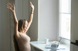 © fizkes - Portrait of a young attractive cheerful woman, celebrating success, victory, sitting at the laptop. Small home office interior. Business concept photo, lifestyle