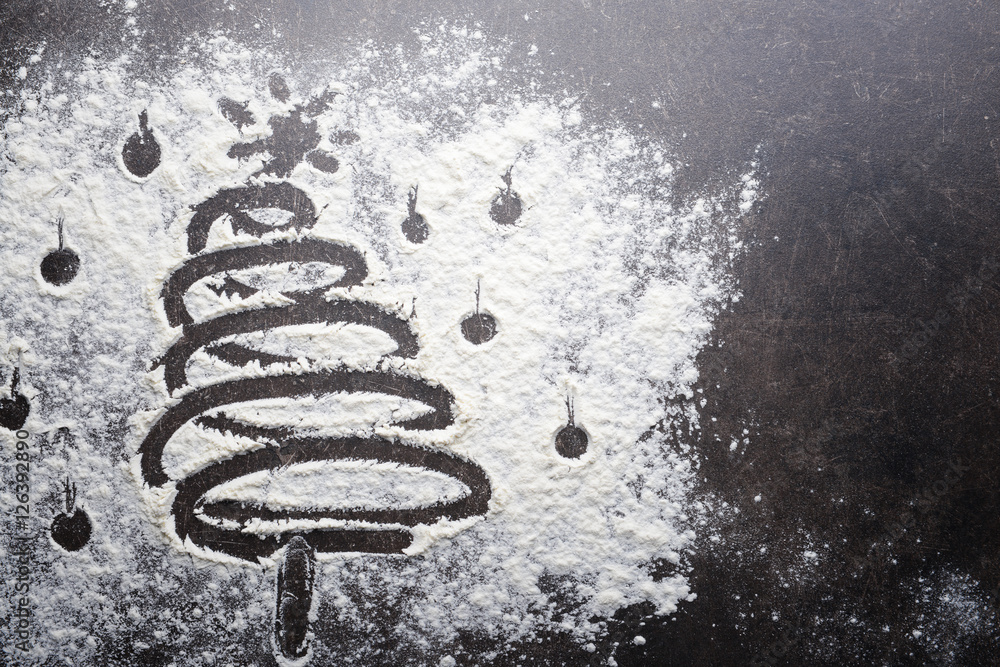 Christmas tree made of flour on grey table