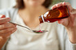 © Syda Productions - woman pouring medication from bottle to spoon