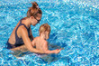 © korisbo - Baby girl learn to swim in pool  with her mother