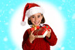 © javiindy - Little girl wearing santa hat carrying many gift boxes