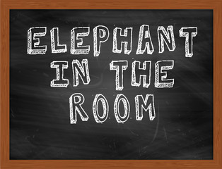 ELEPHANT IN THE ROOM handwritten text on black chalkboard