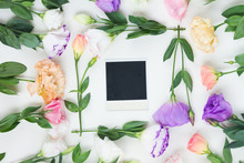 Pink, White And Violet Eustoma Flowers Frame With One Instant Photo