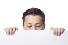 Man Hiding Behind The White Paper