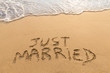 Just married written in the sand, tropical beach, honeymoon travel