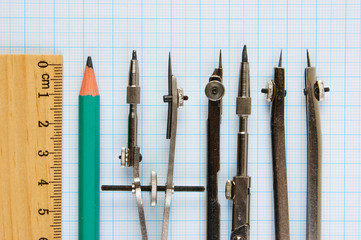 Old drawing tools on graph paper