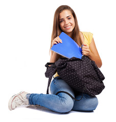 Wall Mural - young woman sitting with a backpack isolated on white