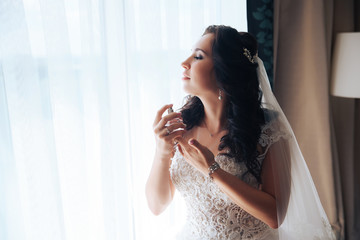 Wall Mural - the bride holds the spirits, standing at the window