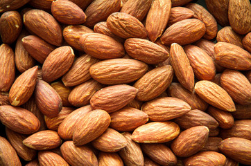 close up Peeled almonds nut background