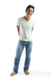 © Alexander - Young man in T-shirt and jeans, standing, smiling at camera