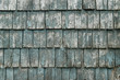 Weathered wooden shingle detail.