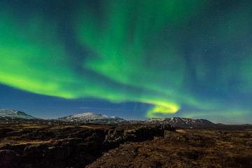 Wall Mural - aurora borealis over the thingvellir national park - iceland