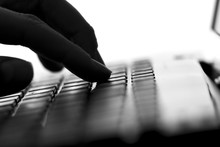 Silhouette Of A Female Hands Typing On The Keyboard
