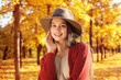 © Africa Studio - Portrait of beautiful young woman wearing hat in autumn park