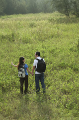 a couple hiking outdoors in the nature