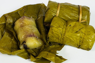 Porridge tie. Sticky rice wrapped in banana leaves, banana banana filling, steamed cooked food.
