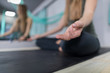 © mast3r - Woman Doing Yoga Exercises In Gym, Closeup Sport Fitness Girl Sitting Lotus Pose Meditation Relaxation