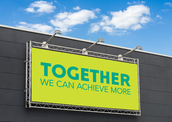 Wall Mural - Together we can achieve more written on a billboard