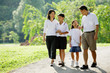 © Alexander - Family walking in park