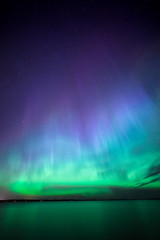 Northern lights over lake in finland