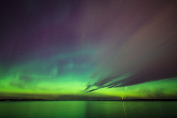 Wall Mural - Northern lights over lake in finland