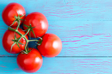 Five Hydroponic Tomatoes On Stem With Copy Space
