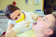 © Firma V - boy is treated by female dentist